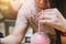 Closeup women drinking cool ice smoothie fruit pink