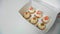 Closeup. Women get homemade cakes from the box