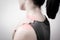 Closeup women neck and shoulder pain/injury with red highlights on pain area with white backgrounds