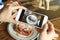 Closeup of women`s hands taking photo of sweet dessert by smartphone.