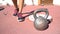 Closeup of women shoes next to weight in crossfit gym