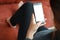 Closeup women use smart phone mobile white screen on sofa decor