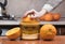 Closeup on womenâ€™s hand making fresh orange juice. Female hand squeezing orange juice. Juicing orange