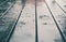 Closeup of wood planks while raining in perspective. Background of wooden natural surface and raindrops