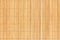 Closeup wooden background of beige bamboo sticks