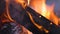 Closeup of wooden beam in flame, forest fires and damages, arson emergency