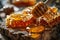 closeup wooden honey spoon with honey flowing onto honeycombs on wooden background