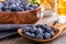 Closeup of a Wooden Spoonful of Fresh Blueberries