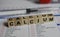 Closeup of word calcium on laboratory requisition slip with syringe and vial