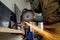 Closeup of worker using a grinder cuts metal in a workshop