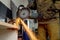 Closeup of worker using a grinder cuts metal in a workshop