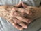 Closeup wrinkled hands of a senior person