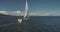 Closeup yacht cruise at open sea aerial. Seascape of ocean harbor. Regatta race on luxury sailboat