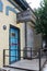 Closeup of yellow brick building with bright blue doorways, Austin, Texas, 2018