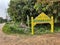 Closeup of Yellow Colored Concrete Name Board or Precast RCC Sign Board with regional language written as Vinayaka Badavane