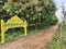 Closeup of Yellow Colored Concrete Name Board or Precast RCC Sign Board with regional language written as Vinayaka Badavane