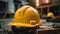 A closeup of yellow construction helmet, A beautiful construction yard in the background. Generative AI