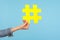 Closeup of yellow hash sign, female hand holding paper hashtag, symbol of social network trends and popular comments