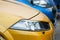 Closeup of yellow Renault Megane rs sport front parked in the street