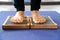 Closeup of yoga person standing on sadhu board with sharp nails