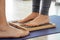 Closeup of yoga person standing on sadhu board with sharp nails