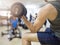 Closeup of a young athlete man lifting weights