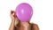 Closeup of young blonde woman and pink helium balloon popping