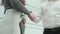 Closeup young business man and woman handshake in the modern office, businessman and businesswoman greeting.