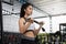 Closeup of a young fitness asian woman workout at sport club