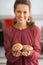 Closeup on young housewife holding mushrooms