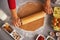 Closeup on young housewife rolling pin dough in kitchen