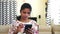 Closeup of a young Indian woman operating a mobile phone