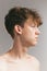 Closeup young man, teen isolated on grey studio background. Concept of teenage skin care, health, cosmetics for problem