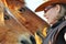 Closeup young pretty woman talking to two horses