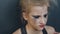 Closeup of young teenage girl dancer crying after loss perfomance sits on floor in dance studio indoors