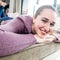 Closeup of young woman enjoying lying down for home wellbeing