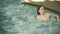 Closeup young woman relaxing in whirlpool bath. Beautiful girl enjoying Jacuzzi