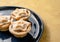 Closeup of yummy star-shaped mince pies served on a dish, a traditional Christmas dessert