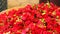 Closeupa shot of a pile of red marigold flower heads