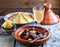 Closeview of tajine of beef with prunes and almonds. In tradiotional Moroccan dish.