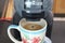 Closeâ€‹ upâ€‹ blackâ€‹ coffeeâ€‹ orâ€‹ Americanoâ€‹ coffeeâ€‹ withâ€‹ coffeeâ€‹ machine.â€‹