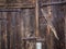 Closing details of an old wooden barn door