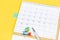 Closing month calendar for 2021 on yellow background, planning a business meeting or travel planning concept