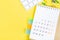 Closing month calendar for 2021 on yellow background, planning a business meeting or travel planning concept