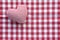 Cloth heart from checked pattern fabric on a red and white check