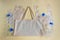 On the cloth reusable bag lie cellophane disposable bags, gloves