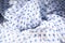 Cloth. White fabric with blue hearts, textile background