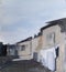 The clothes are drying outside near old house