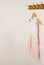 Clothes hanger with pink girl tutu dress isolated on the white door. Fashion, baby clothes. Copy space.