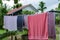 Clothes hangin in clothesline at sunny day